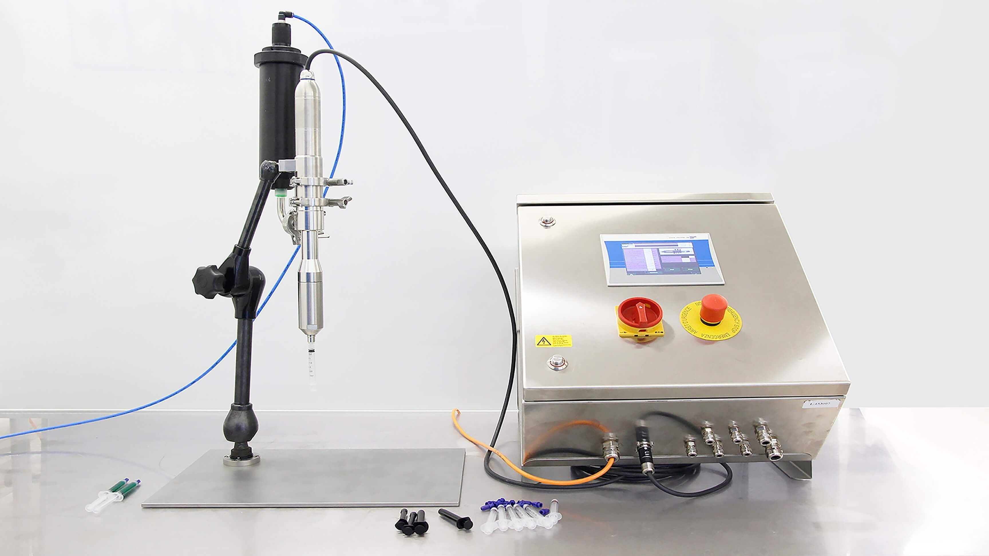 Bench top dosing system for syringes with a Luer Lock connection